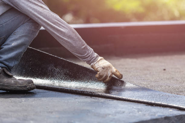 Professional Basement Waterproofing technician working in Burlington, MI
